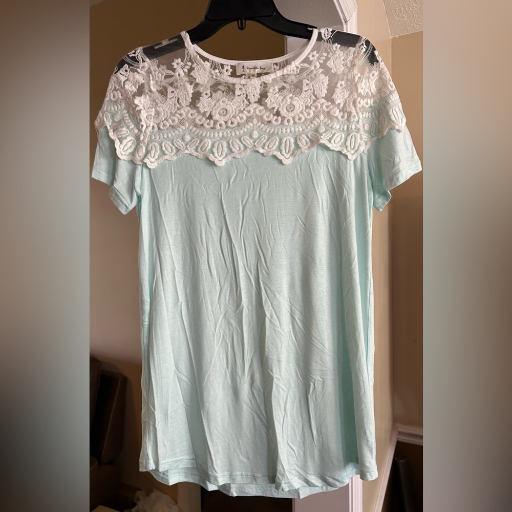 Vanilla Bay top. Light Blue. See through lace top. Medium.
